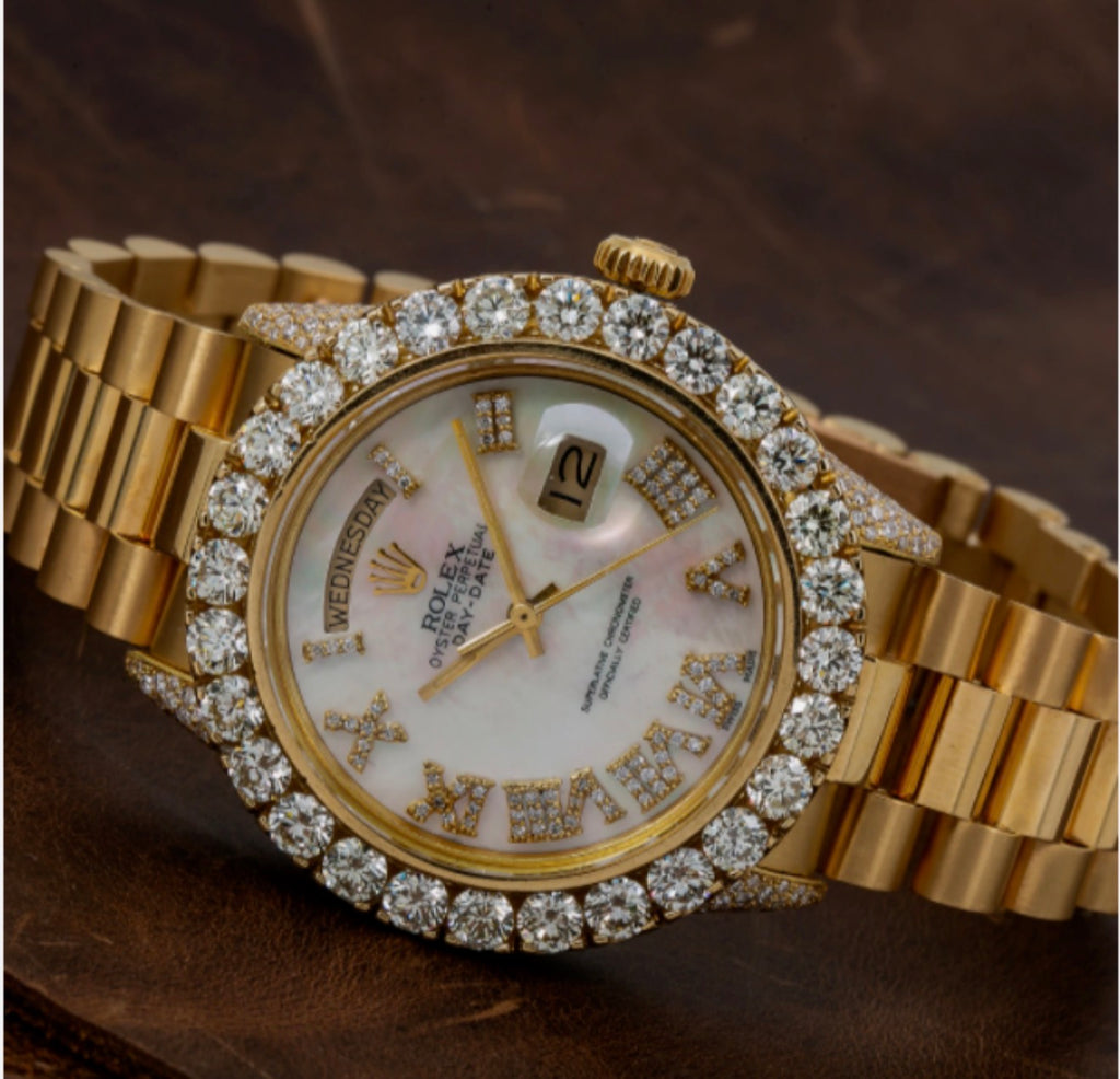 Rolex Day-Date 36mm features a white mother-of-pearl dial and a custom aftermarket diamond bezel