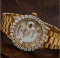 Rolex Day-Date 36mm features a white mother-of-pearl dial and a custom aftermarket diamond bezel