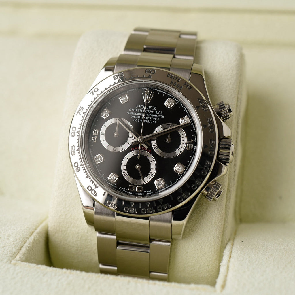 Rolex Daytona 116509, featuring a white gold case and a black dial adorned with diamond hour markers