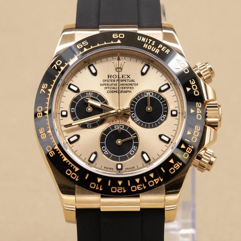 Rolex Cosmograph Daytona 116518LN, featuring an yellow gold case paired with a distinctive black Cerachrom bezel and an Oysterflex strap
