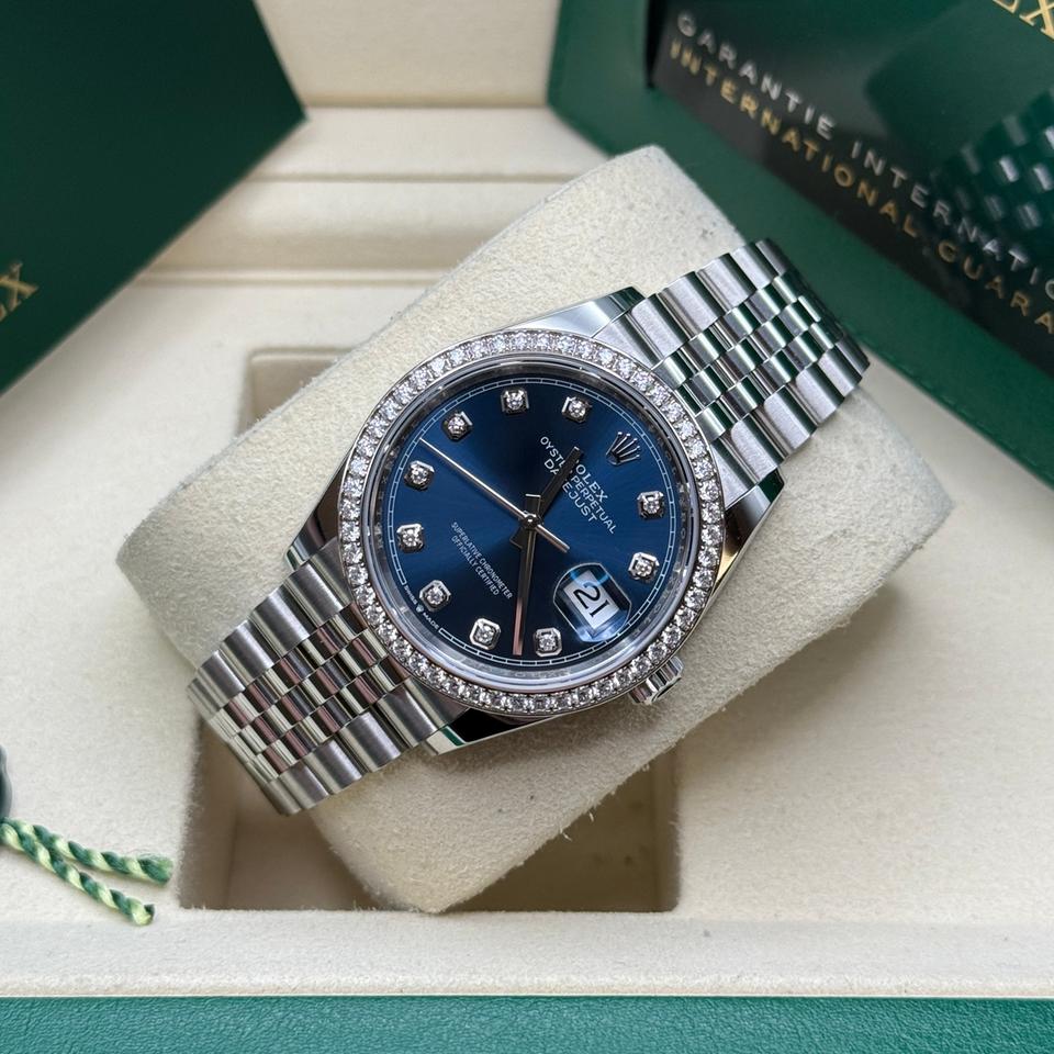 Rolex Datejust features a blue dial and a diamond bezel