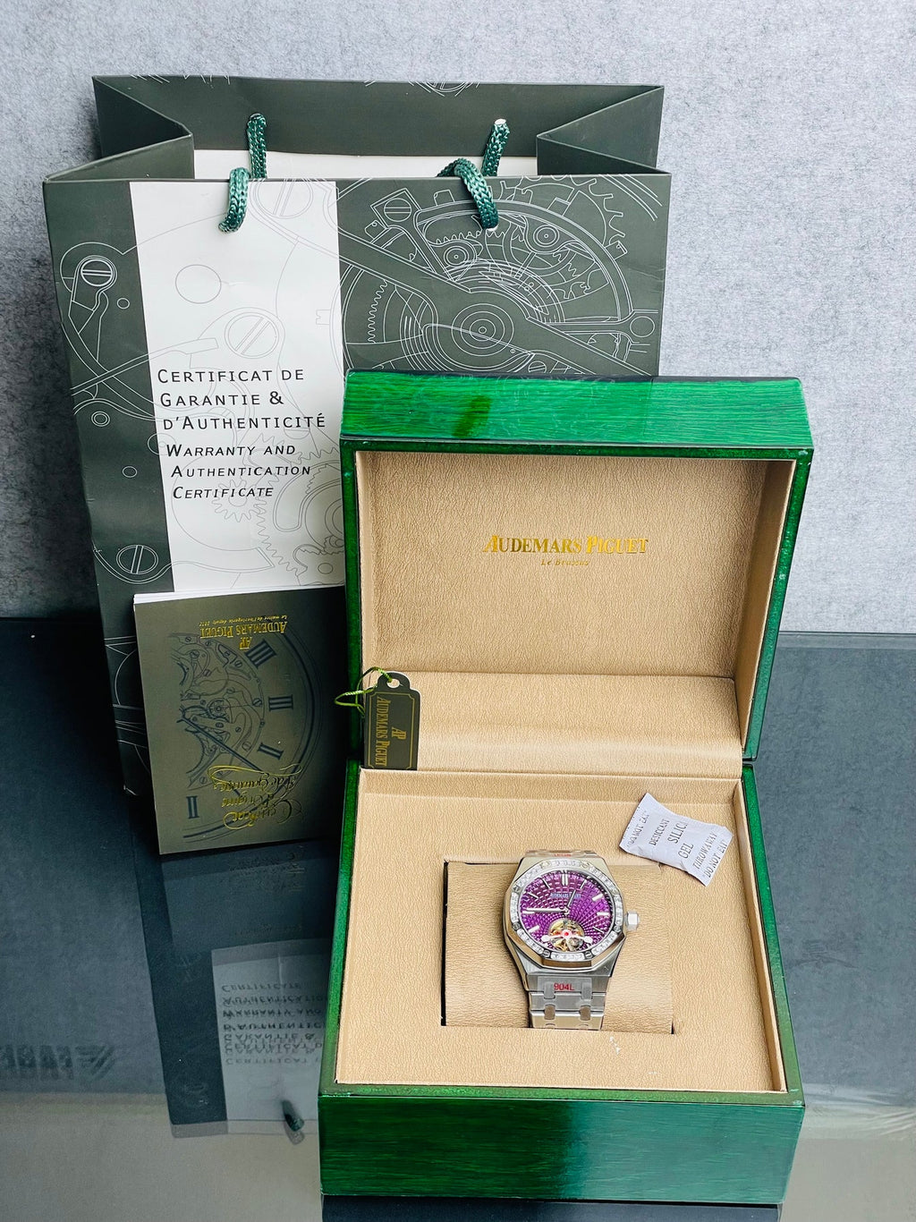 Audemars Piguet Royal Oak Selfwinding Flying Tourbillon features a purple "Plum" dial with a distinct sunburst tapisserie pattern.