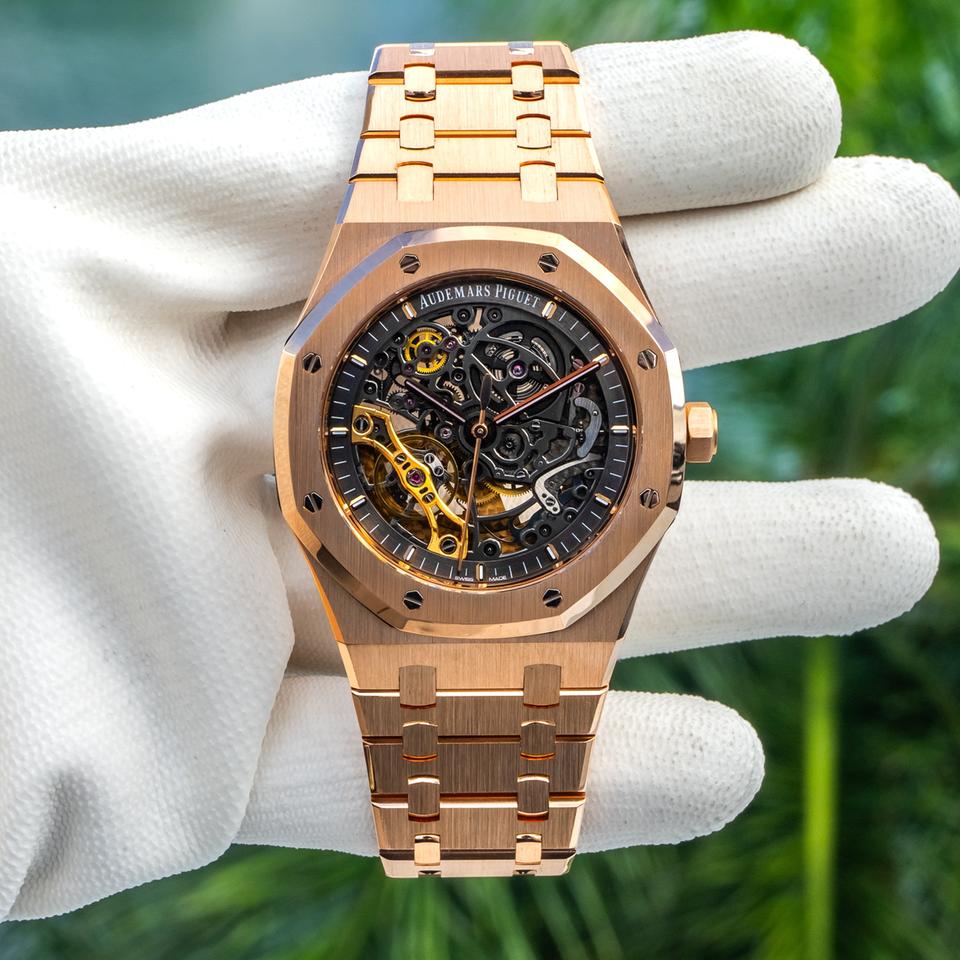 Audemars Piguet Royal Oak Openworked watch features a distinctive gold stainless steel octagonal bezel with visible screws and an intricate skeletonized dial.