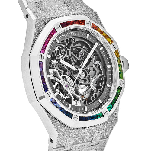 Audemars Piguet Royal Oak Double Balance Wheel Open-worked features a frosted white gold finish and a bezel set with rainbow-colored baguette-cut sapphires