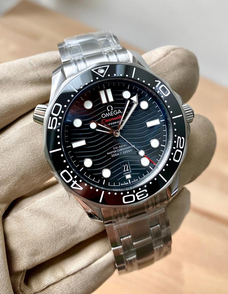Omega Seamaster Diver 300M, distinguished by its black ceramic wave-patterned dial and stainless steel bracelet