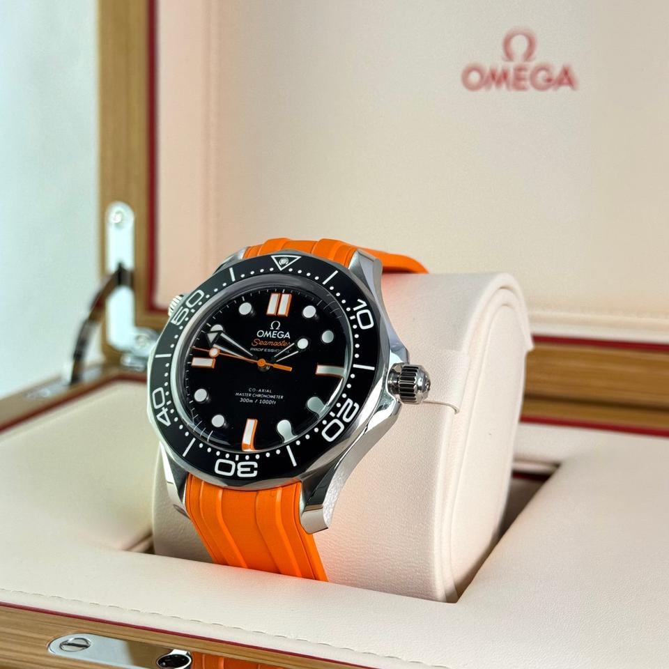 Omega Seamaster Diver 300M features a striking black matte dial paired with a vibrant orange rubber strap
