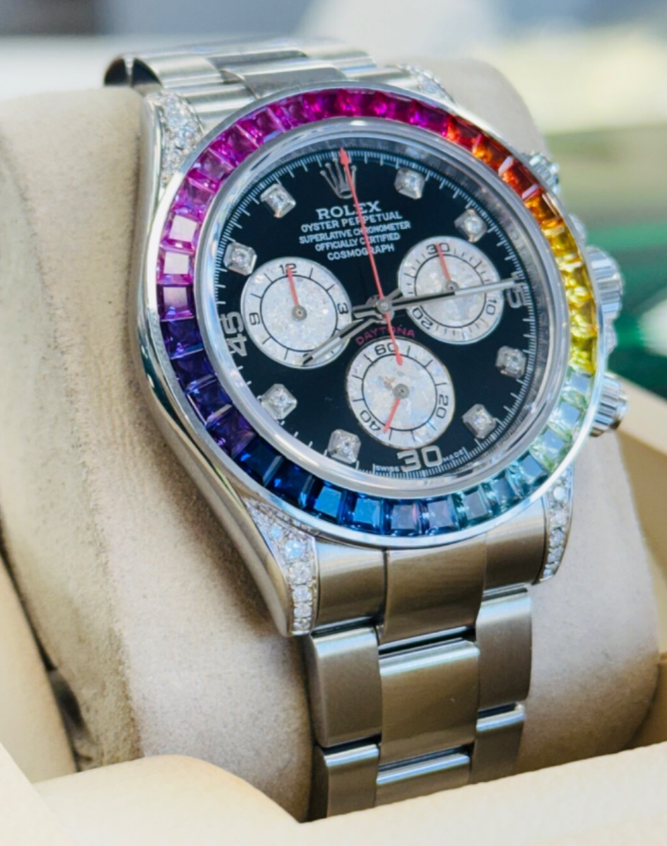 Rolex Cosmograph Daytona features a custom rainbow sapphire bezel and diamond-set lugs