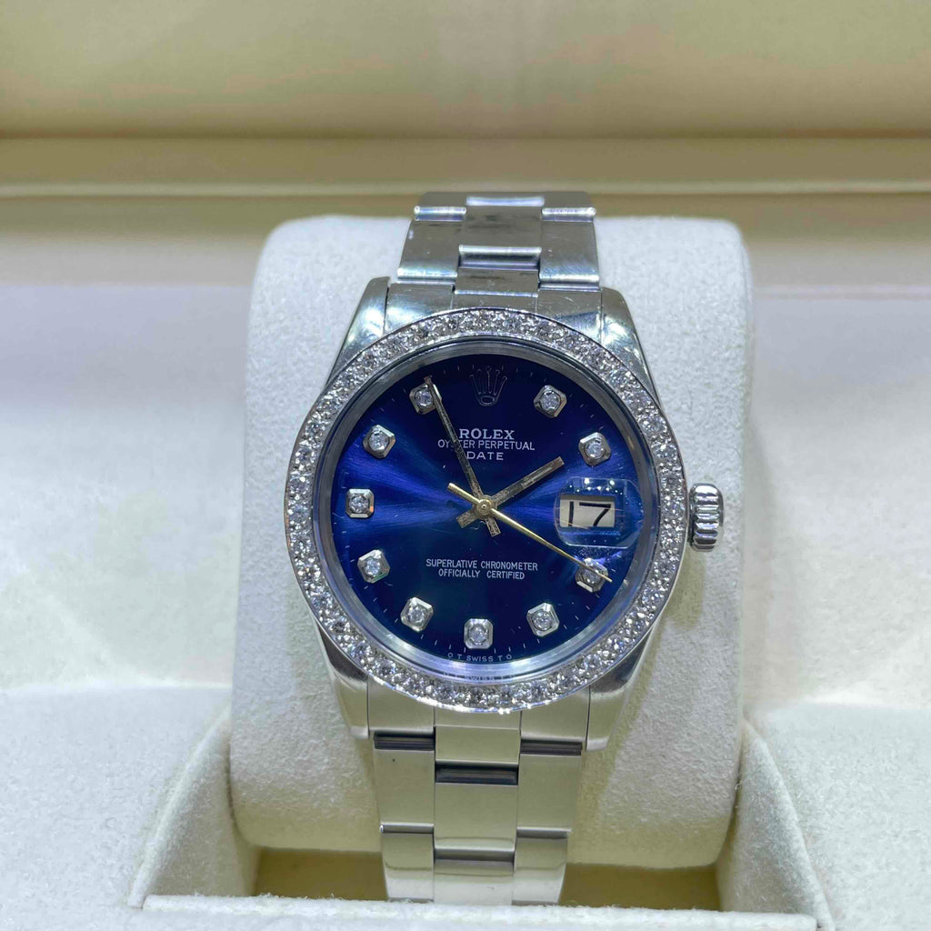 Rolex Datejust features a blue dial and a diamond bezel