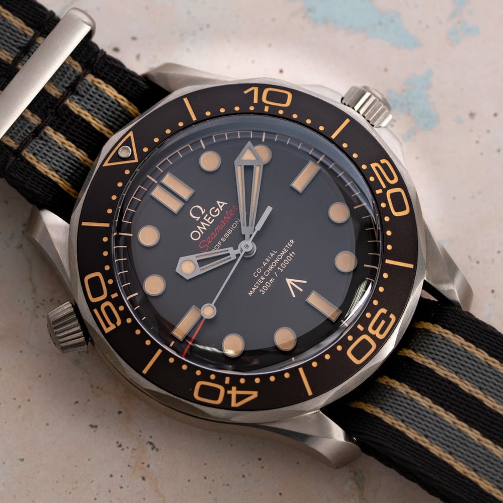 Omega Seamaster Diver 300M 007 Edition watch, featuring a lightweight titanium case and a tropical brown dial