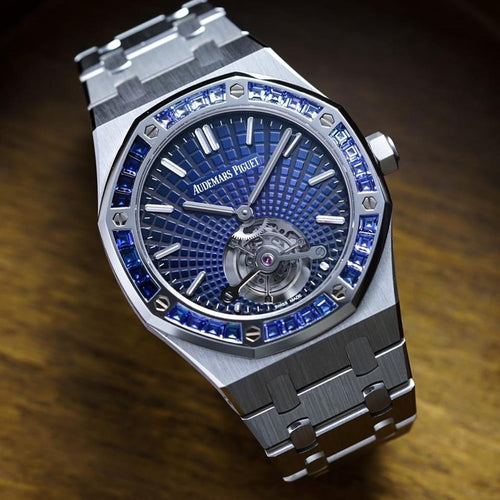 Audemars Piguet Royal Oak Tourbillon Extra-Thin features a platinum case and a bezel set with baguette-cut blue sapphires