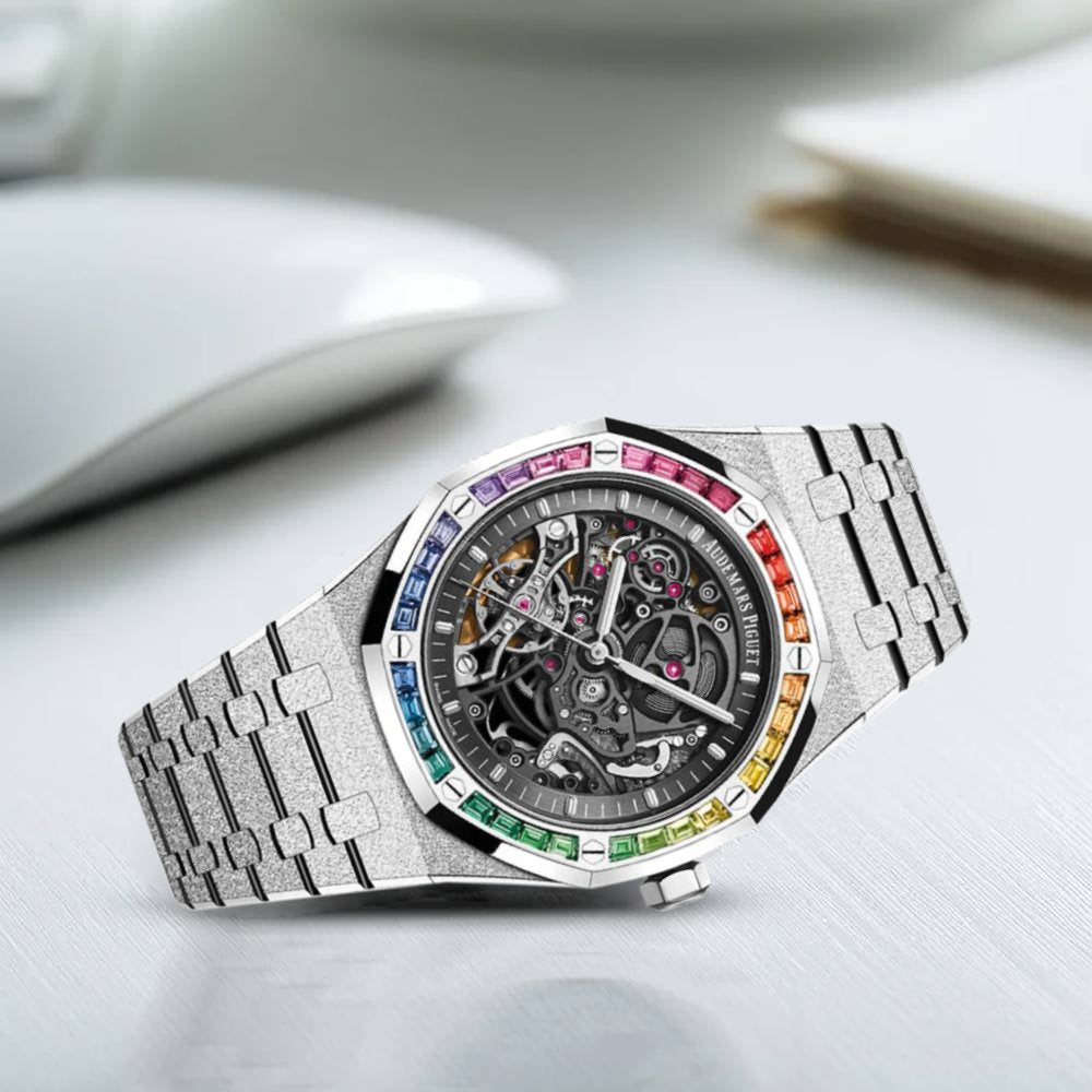 Audemars Piguet Royal Oak Double Balance Wheel Open-worked features a frosted white gold finish and a bezel set with rainbow-colored baguette-cut sapphires