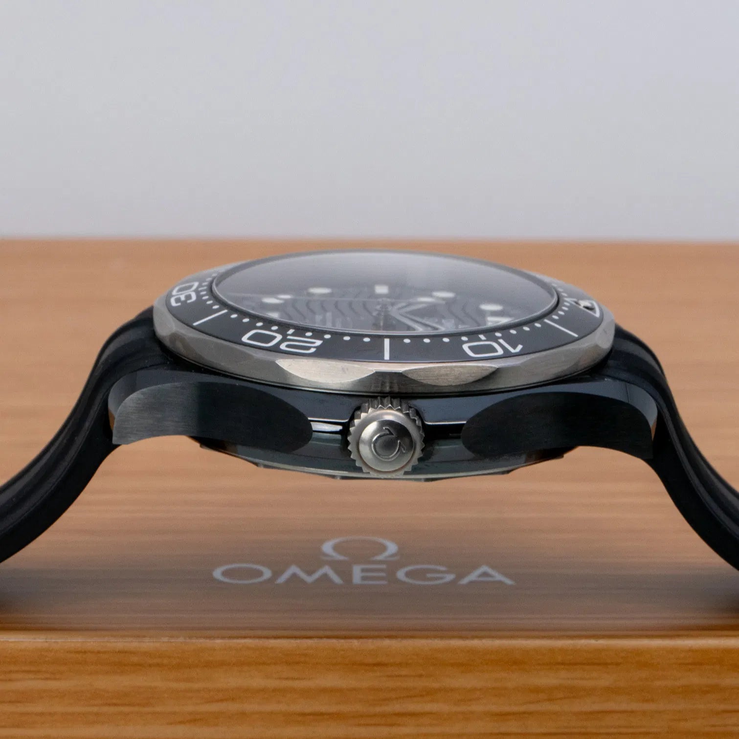 Omega Seamaster Diver 300M Co-Axial Master Chronometer with a black ceramic case and a matching black rubber strap
