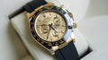 Rolex Cosmograph Daytona 116518LN, featuring an yellow gold case paired with a distinctive black Cerachrom bezel and an Oysterflex strap