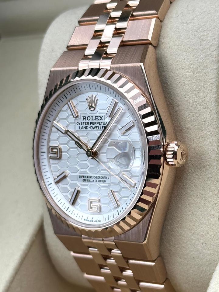 Rolex Land-Dweller watch features an Eve-rose gold case and a unique white honeycomb-motif dial.