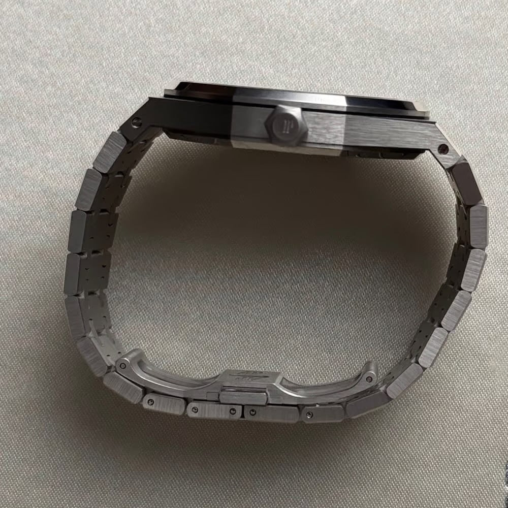 Audemars Piguet Royal Oak Tourbillon Extra-Thin features a platinum case and a bezel set with baguette-cut blue sapphires