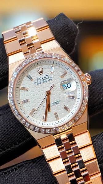 Rolex Land-Dweller watch features a distinctive white honeycomb-motif dial and an Eve-rose gold case