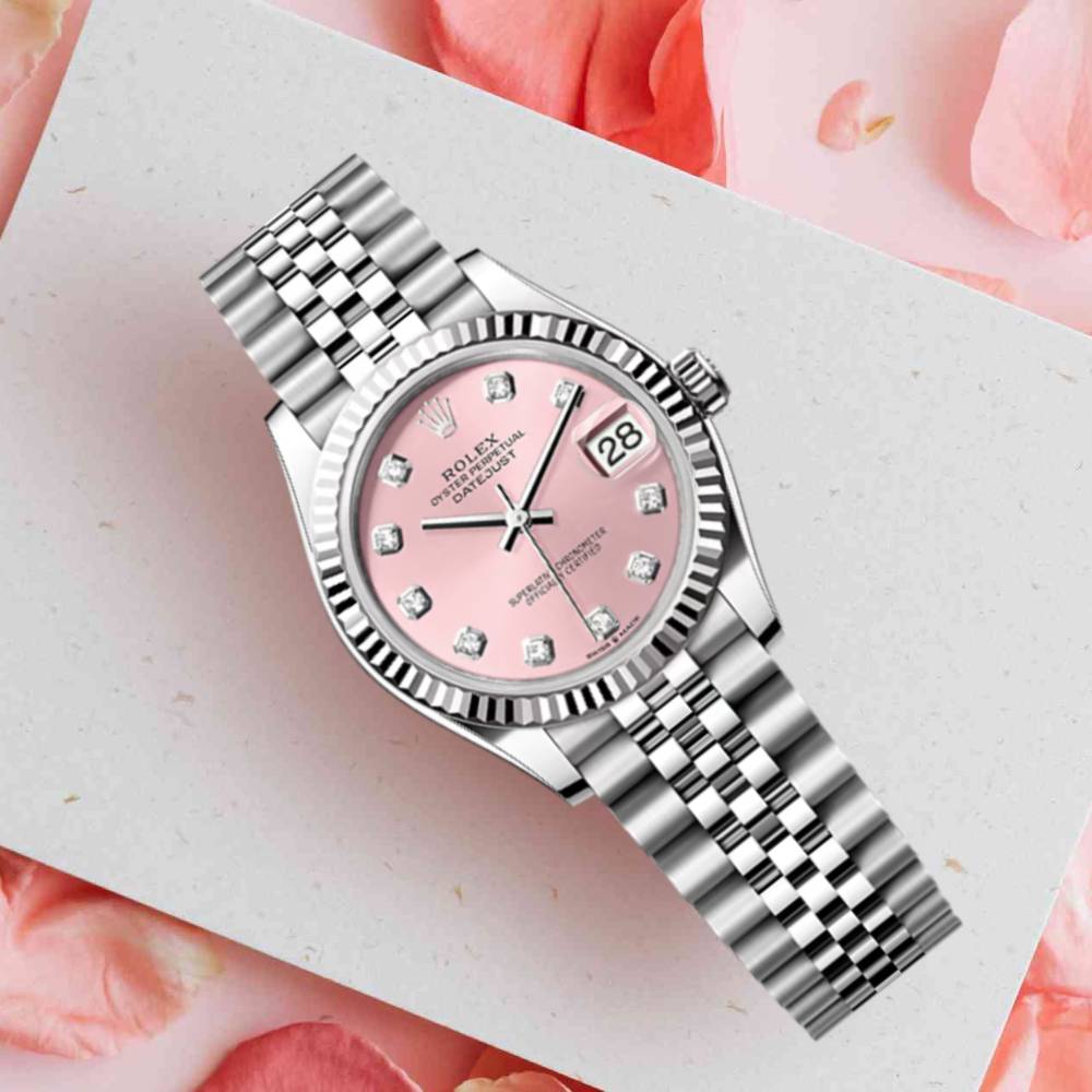 Rolex Datejust 31 features a pink dial with diamond hour markers and a fluted white gold bezel