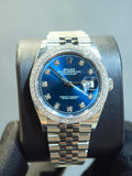 Rolex Datejust features a blue dial and a diamond bezel