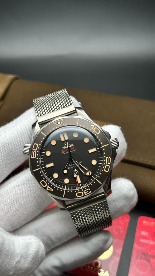 Omega Seamaster Diver 300M 007 Edition crafted from lightweight Grade 2 Titanium with a mesh bracelet.