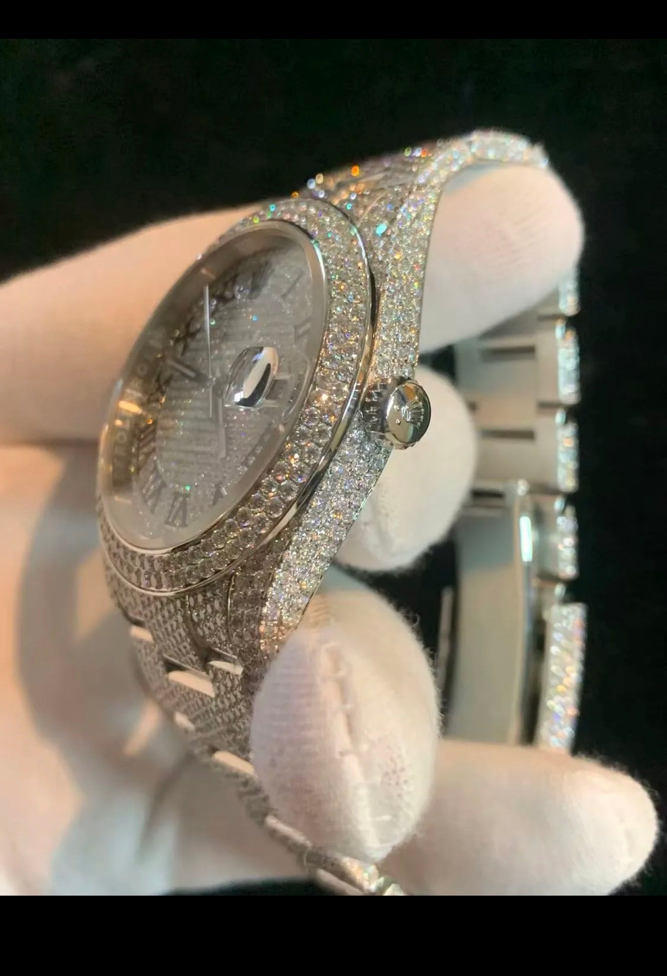 custom-configured Rolex Datejust featuring a full pavé diamond dial with Roman numerals and an aftermarket "iced out" setting covering the case and oyster bracelet