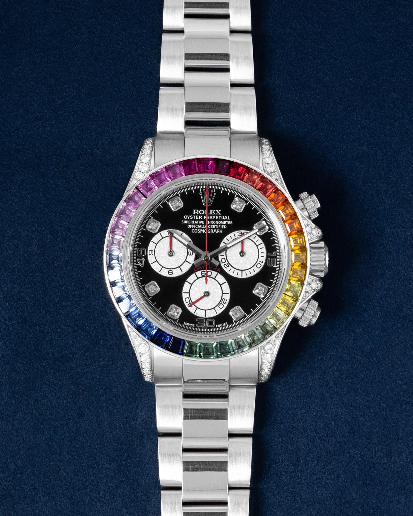 Rolex Cosmograph Daytona features a custom rainbow sapphire bezel and diamond-set lugs