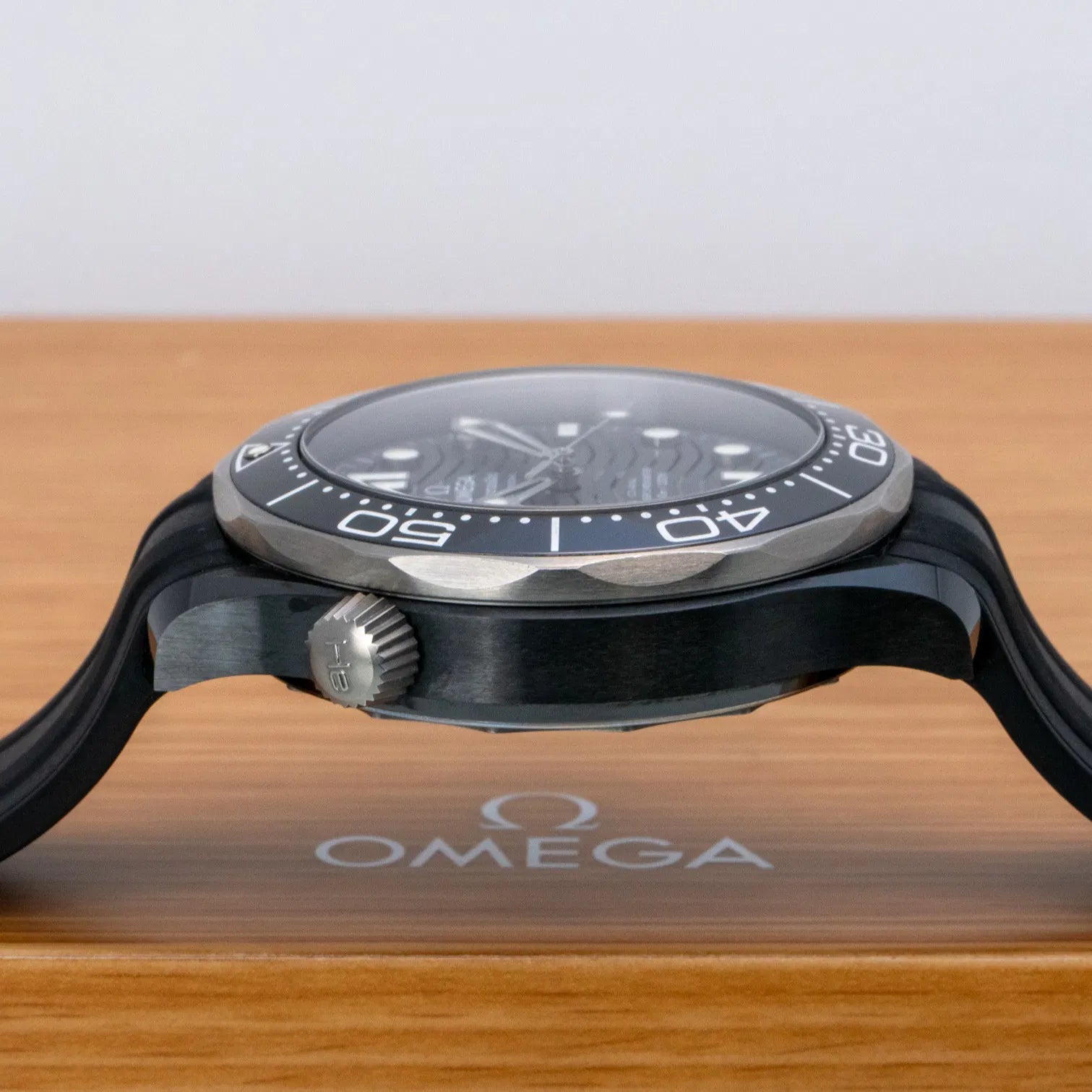 Omega Seamaster Diver 300M Co-Axial Master Chronometer with a black ceramic case and a matching black rubber strap
