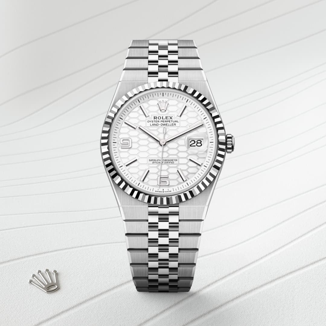 Rolex Land-Dweller features a distinctive white honeycomb motif dial and is paired with a stainless steel Jubilee bracelet