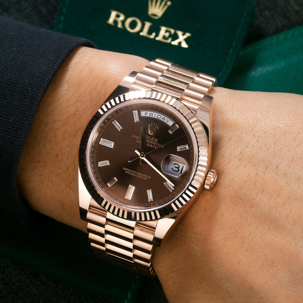 Rolex Day-Date crafted in Everose gold with a distinct chocolate sunray dial