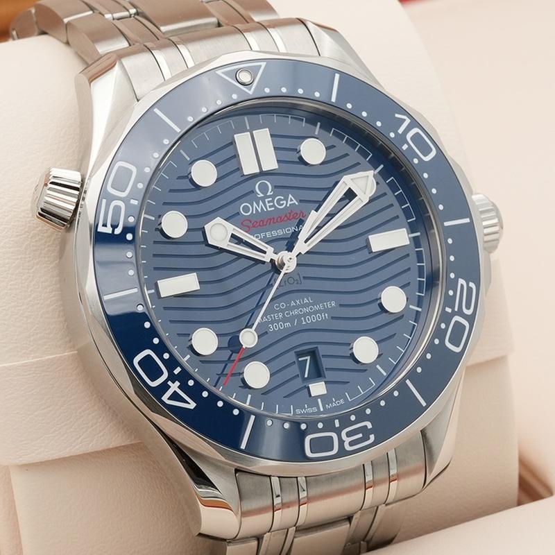 Omega Seamaster Diver 300M watch featuring a distinctive blue ceramic dial with wave patterns