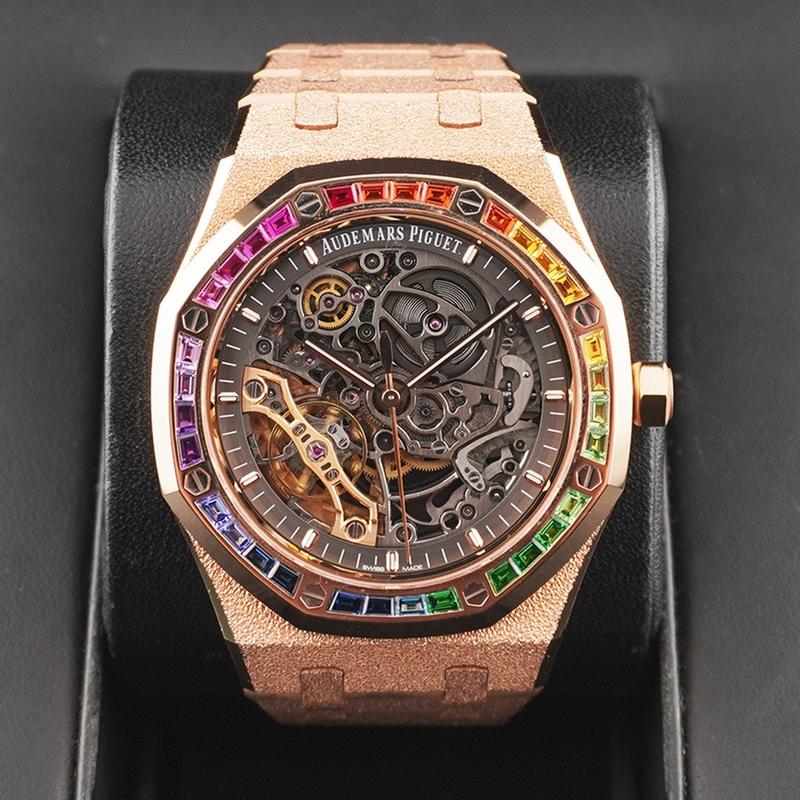 Audemars Piguet Royal Oak Double Balance Wheel Open-worked features a frosted rose gold finish and a bezel set with rainbow-colored baguette-cut sapphires