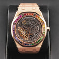 Audemars Piguet Royal Oak Double Balance Wheel Open-worked features a frosted rose gold finish and a bezel set with rainbow-colored baguette-cut sapphires