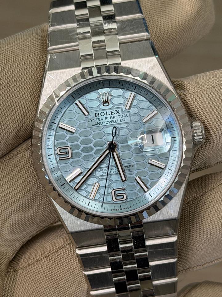 Rolex Land-Dweller watch features a platinum case and an blue dial with a honeycomb motif