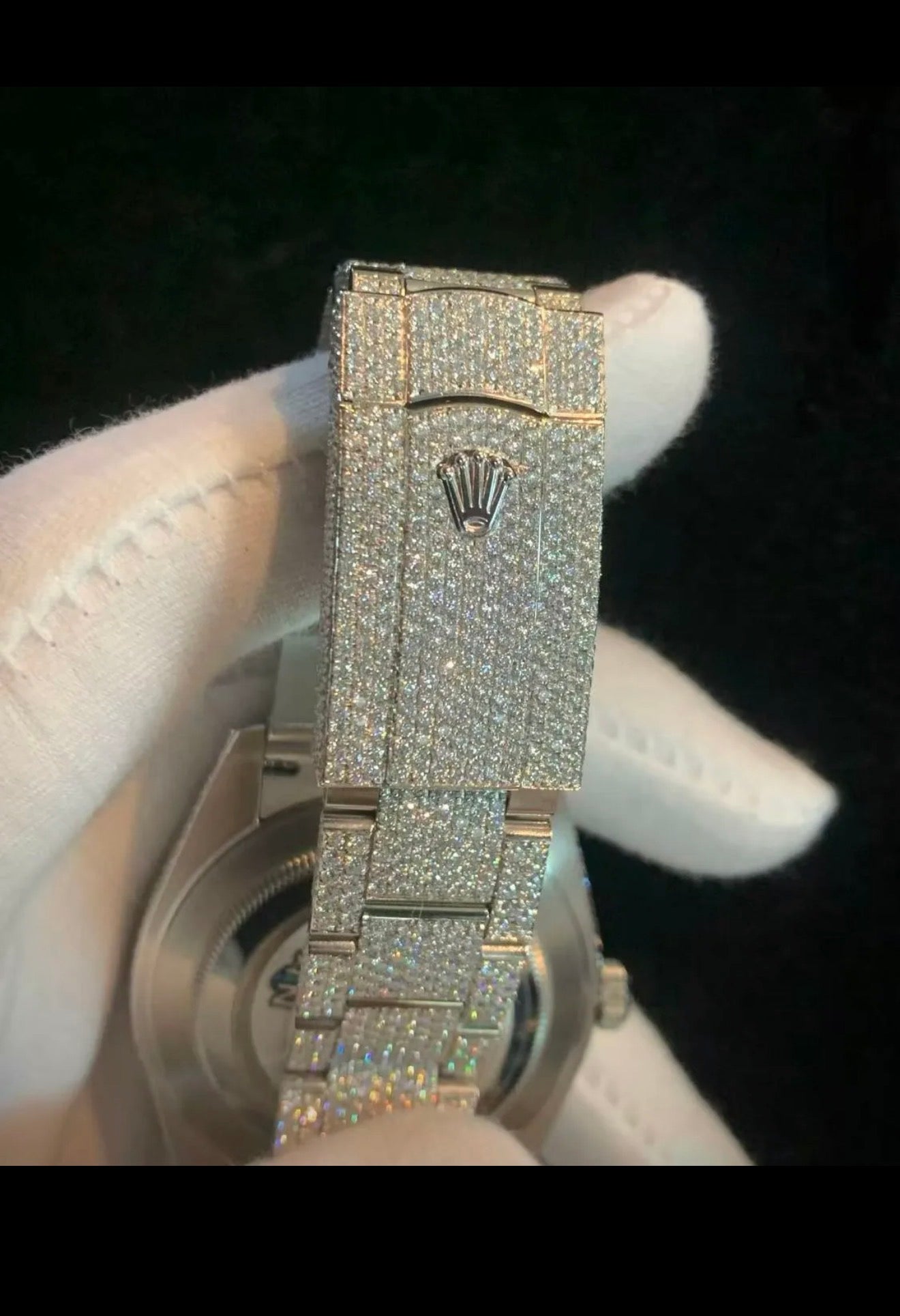 custom-configured Rolex Datejust featuring a full pavé diamond dial with Roman numerals and an aftermarket "iced out" setting covering the case and oyster bracelet