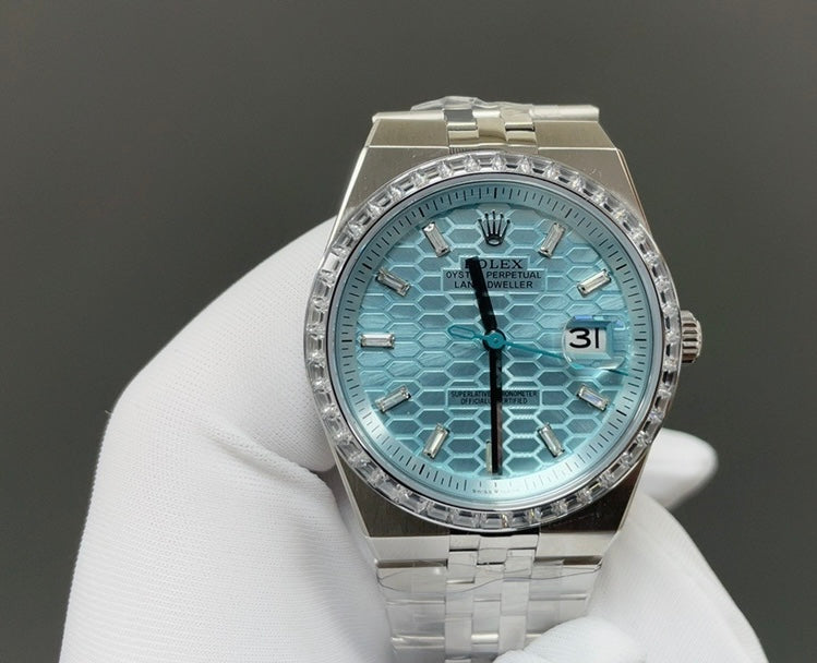 Rolex Land-Dweller in platinum features an blue honeycomb dial and a baguette diamond-set bezel