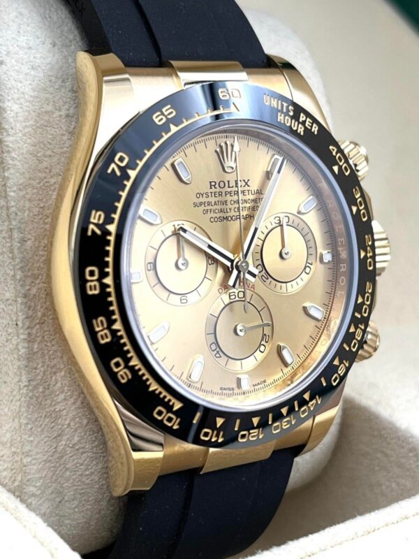Rolex Cosmograph Daytona 116518LN, featuring an yellow gold case paired with a distinctive black Cerachrom bezel and an Oysterflex strap
