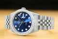 Rolex Datejust features a blue dial and a diamond bezel
