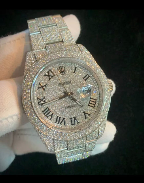custom-configured Rolex Datejust featuring a full pavé diamond dial with Roman numerals and an aftermarket "iced out" setting covering the case and oyster bracelet