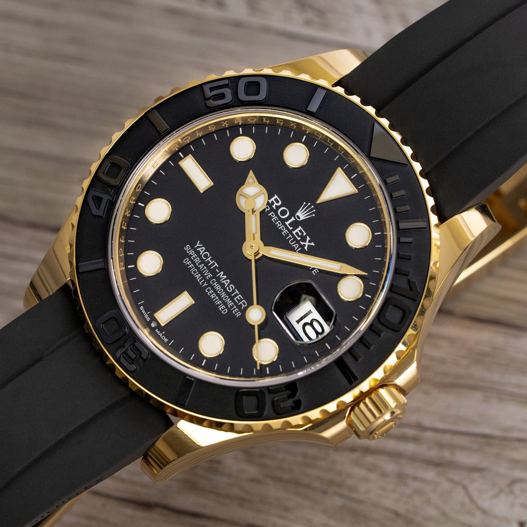 Rolex Yacht-Master features an yellow gold case paired with a black Oysterflex bracelet