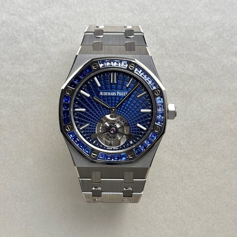Audemars Piguet Royal Oak Tourbillon Extra-Thin features a platinum case and a bezel set with baguette-cut blue sapphires