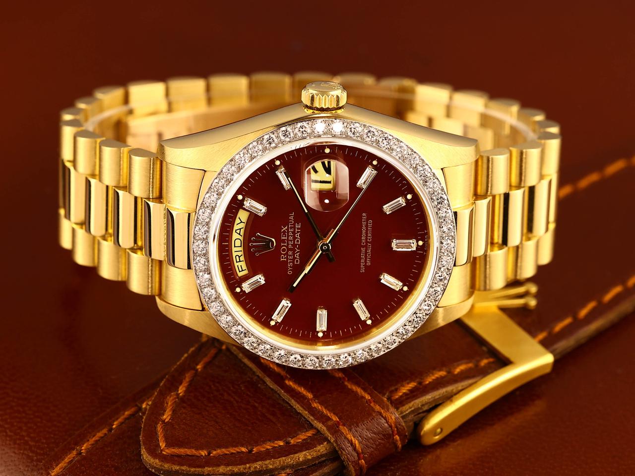 Rolex Day-Date features a distinct red vignette dial and a factory diamond-set bezel