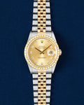Rolex Datejust 16233 features a 36mm stainless steel case with an yellow gold bezel set with diamonds and a champagne diamond dial