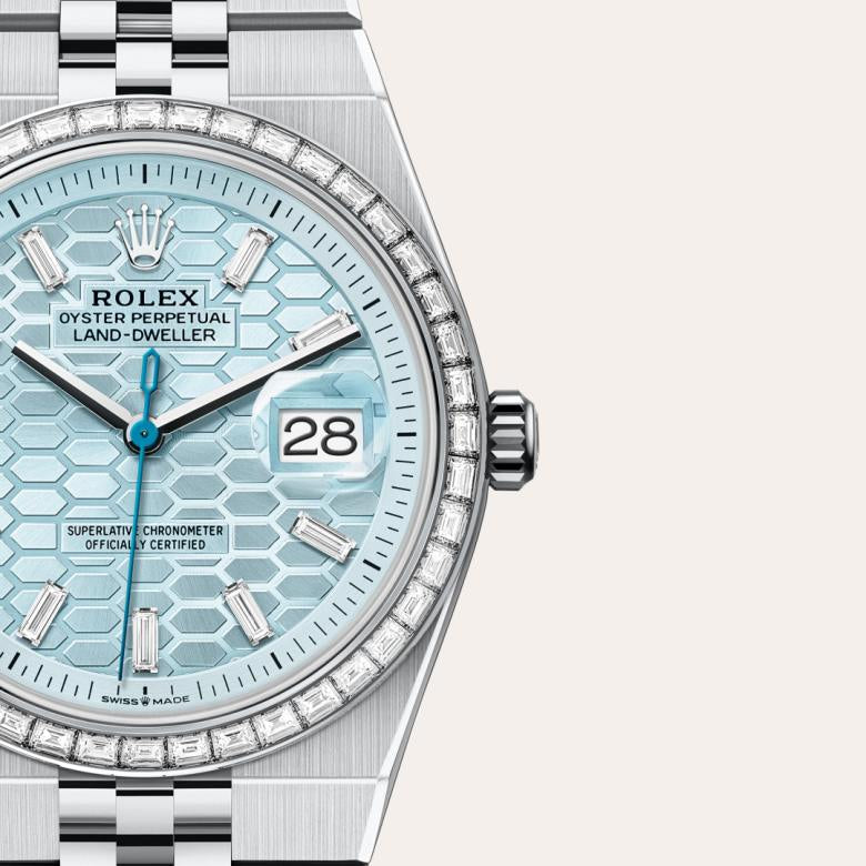 Rolex Land-Dweller in platinum features an blue honeycomb dial and a baguette diamond-set bezel