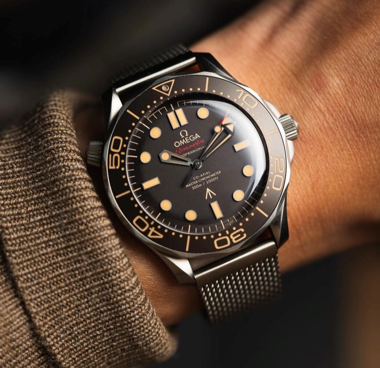 Omega Seamaster Diver 300M 007 Edition crafted from lightweight Grade 2 Titanium with a mesh bracelet.