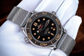 Omega Seamaster Diver 300M 007 Edition crafted from lightweight Grade 2 Titanium with a mesh bracelet.