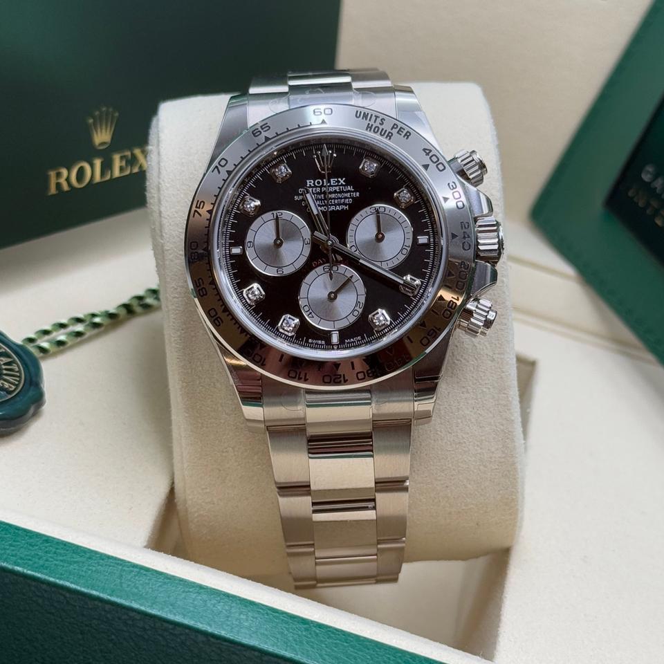 Rolex Cosmograph Daytona platinum in white gold featuring a black dial with diamond hour markers-unique exhibition caseback that showcases the every movement