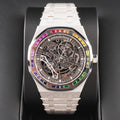 Audemars Piguet Royal Oak Double Balance Wheel Open-worked features a frosted white gold finish and a bezel set with rainbow-colored baguette-cut sapphires