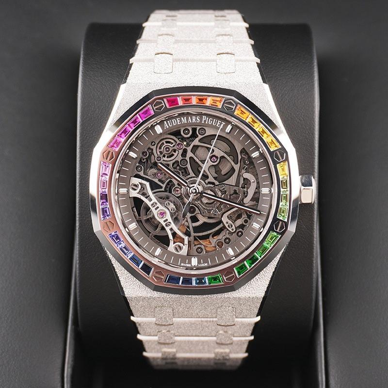 Audemars Piguet Royal Oak Double Balance Wheel Open-worked features a frosted white gold finish and a bezel set with rainbow-colored baguette-cut sapphires
