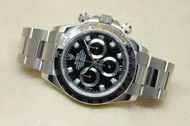 Rolex Daytona 116509, featuring a white gold case and a black dial adorned with diamond hour markers