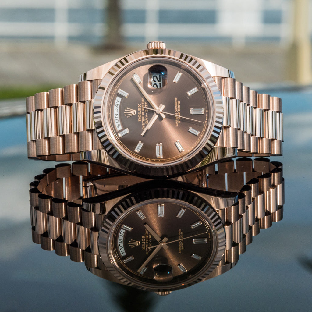 Rolex Day-Date crafted in Everose gold with a distinct chocolate sunray dial