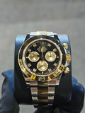 Rolex Cosmograph Daytona watch features a two-tone Oystersteel and yellow gold case with a striking black diamond dial